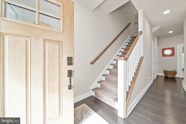 a view of staircase with lots of frames and walls