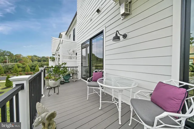 a living room with furniture fireplace and window