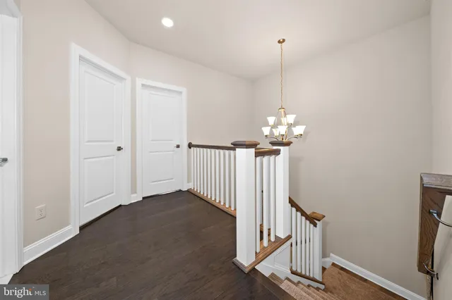 a bedroom with a bed and a chair