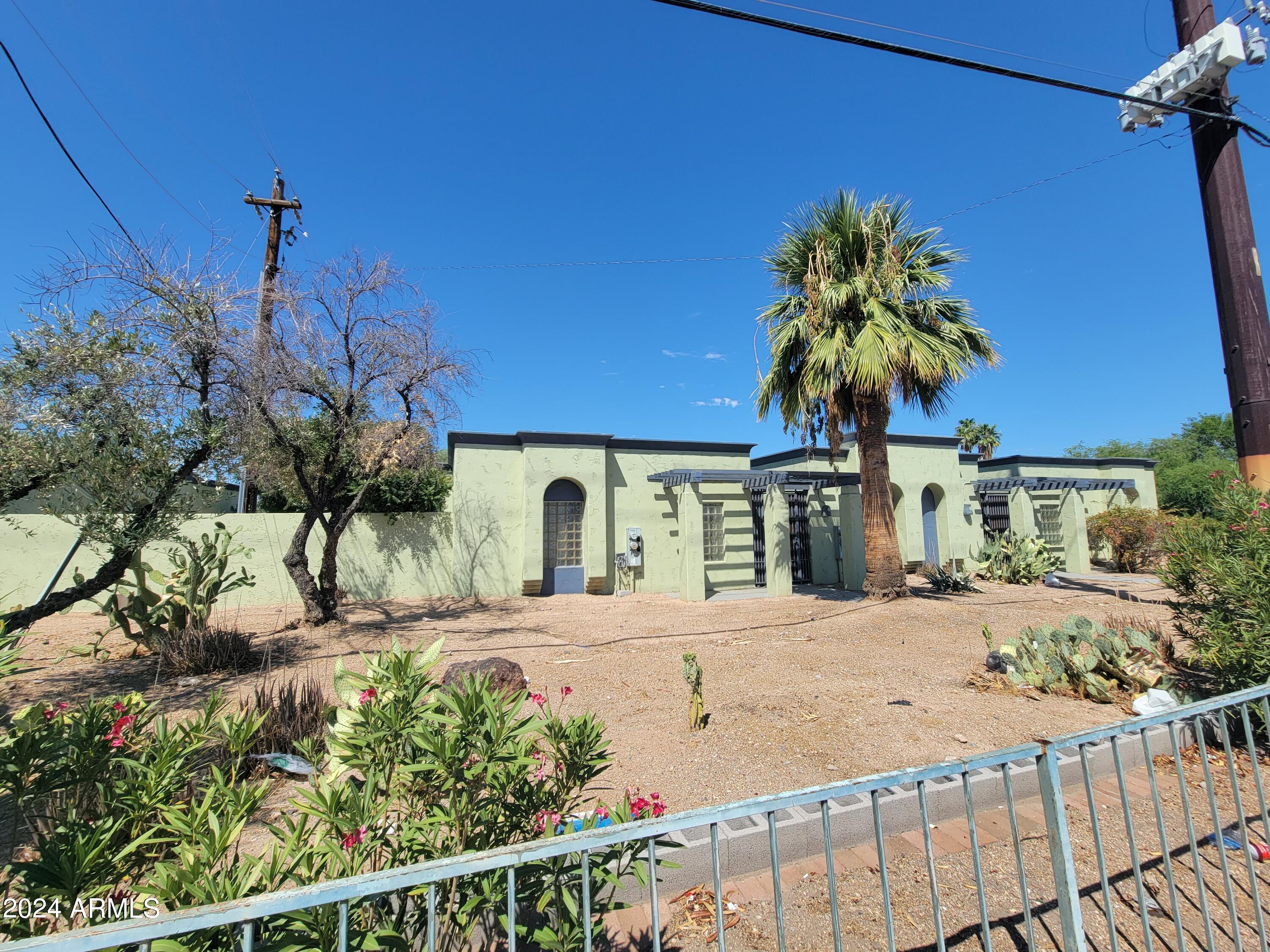 2302 North 36th Street, Unit 2 Phoenix, AZ 85008 - Photo 11 of 11 a front view of a house with a yard