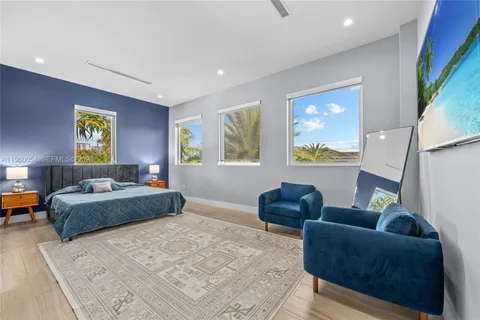 a bedroom with furniture and a window