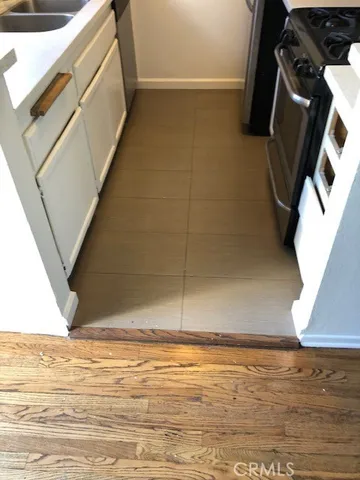 a view of empty room with window and fireplace