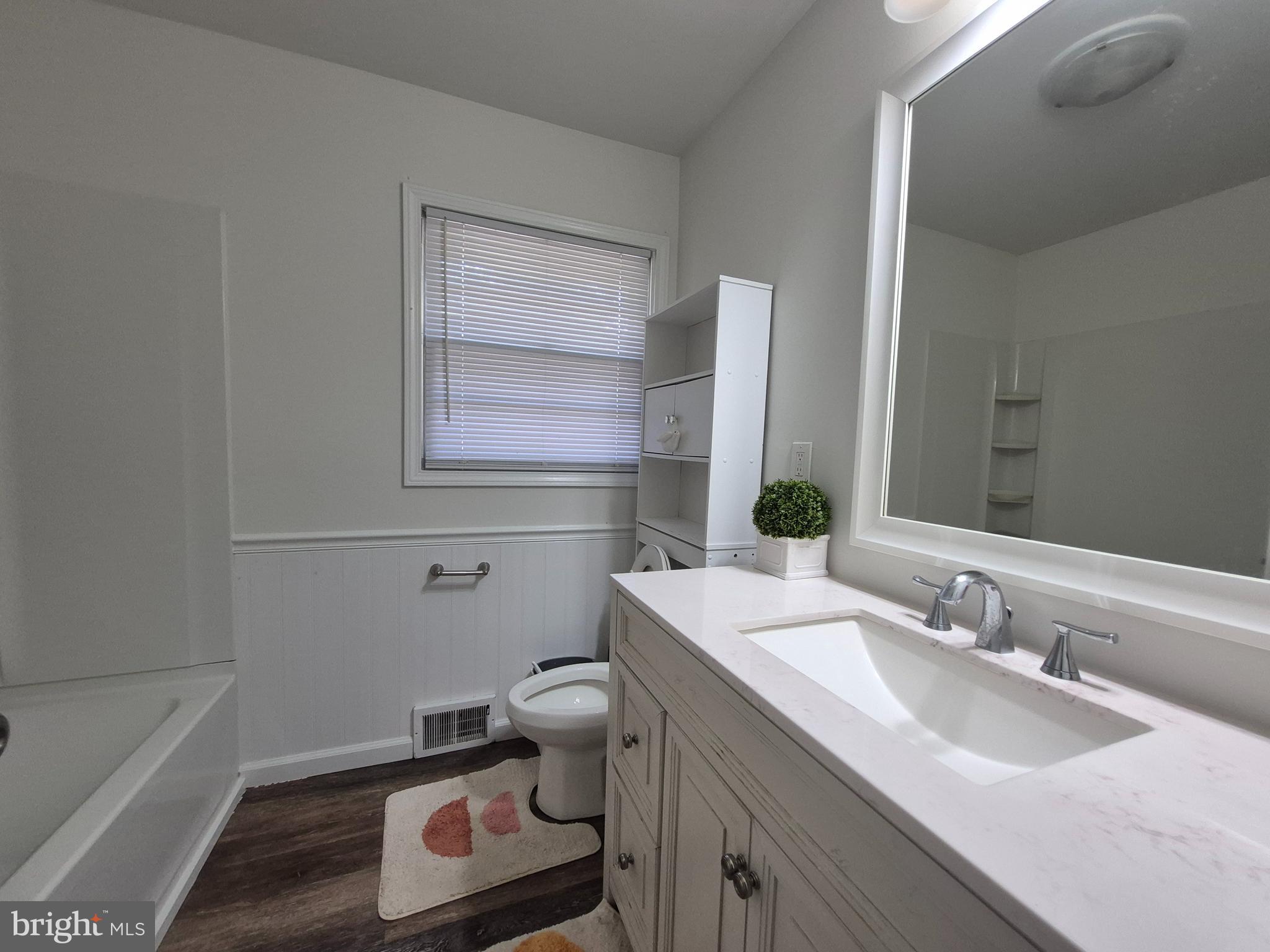 707 West Morris Leonard Road Salisbury, MD 21804 - Photo 11 of 22 a bathroom with a sink toilet and vanity