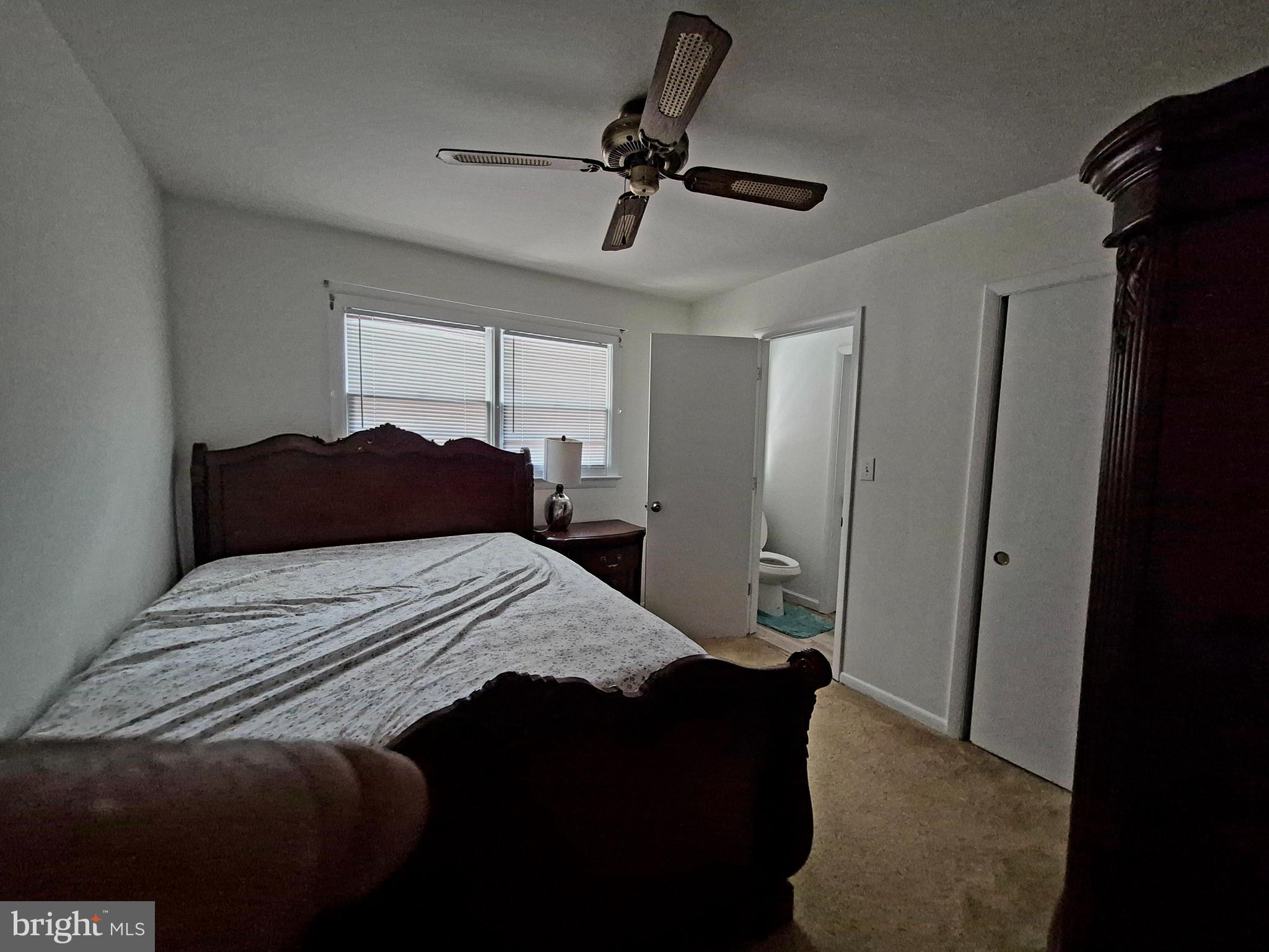 707 West Morris Leonard Road Salisbury, MD 21804 - Photo 17 of 22 a bedroom with a bed and a chandelier