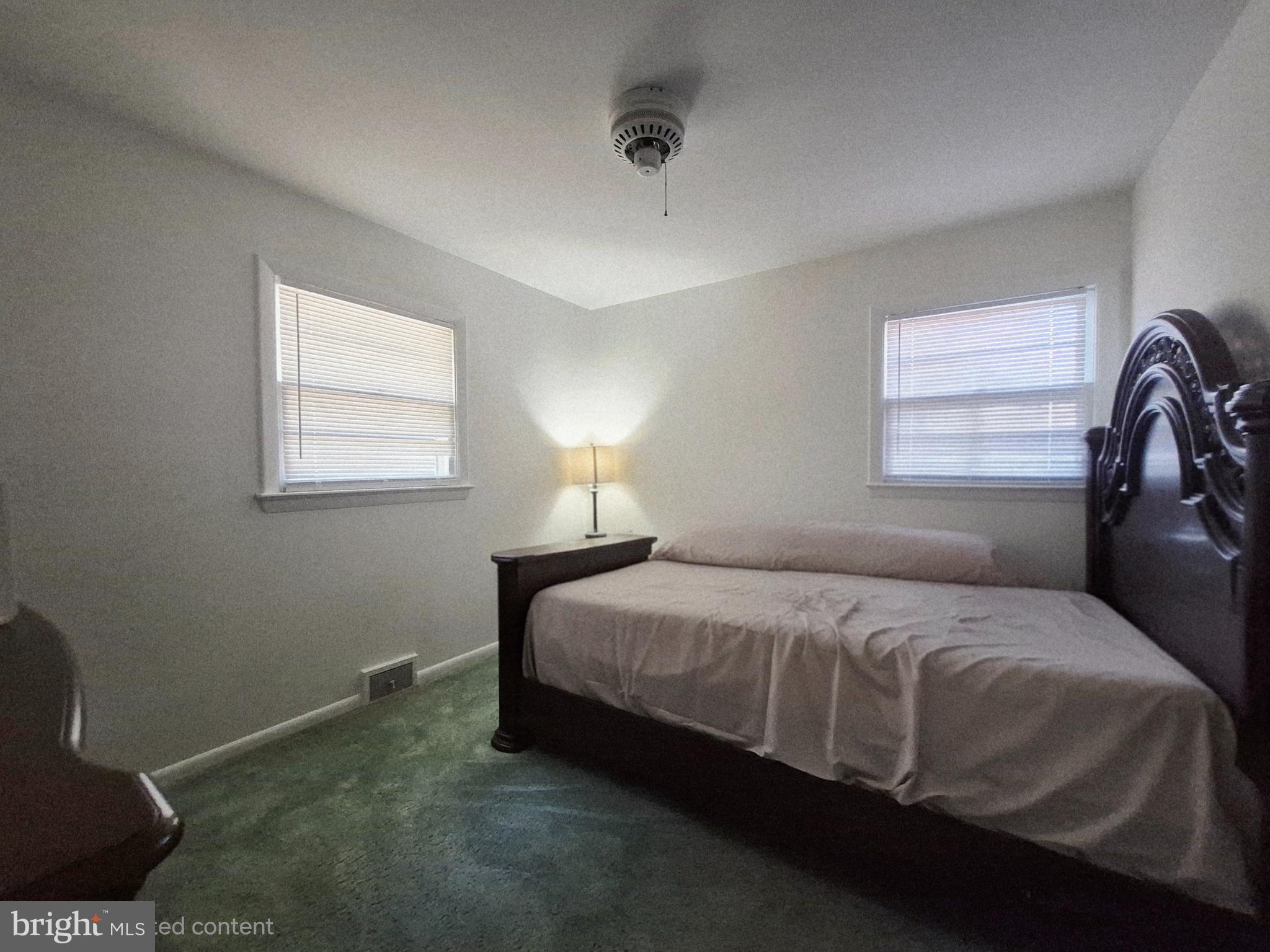 707 West Morris Leonard Road Salisbury, MD 21804 - Photo 18 of 22 a bedroom with a bed and window