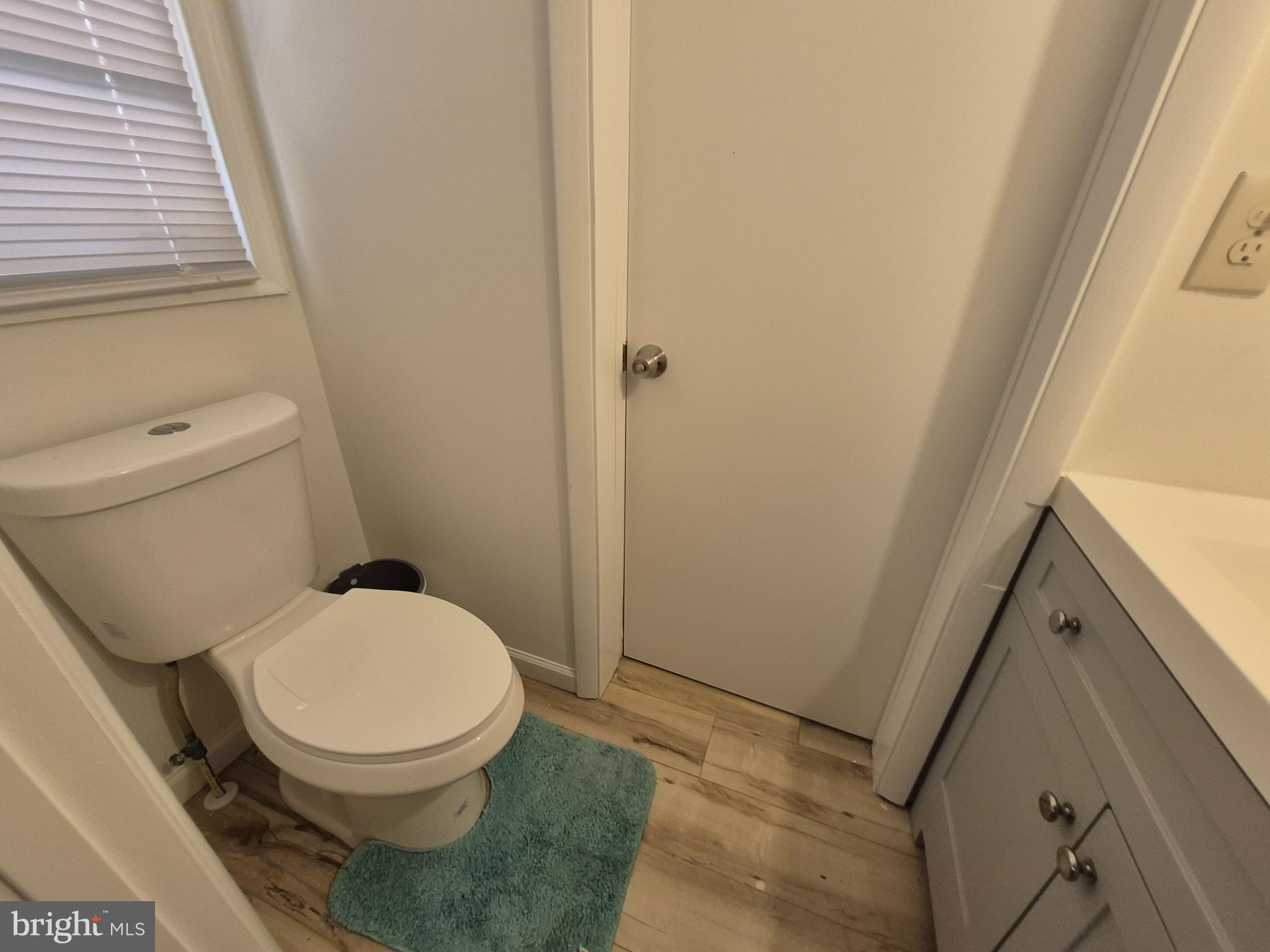 707 West Morris Leonard Road Salisbury, MD 21804 - Photo 10 of 22 a white toilet sitting next to a sink