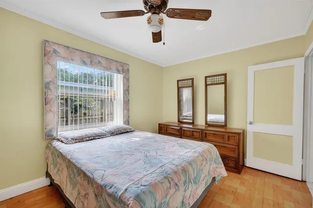 a bedroom with a bed and window