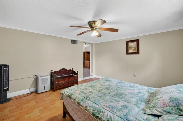 a bedroom with a bed and cabinets
