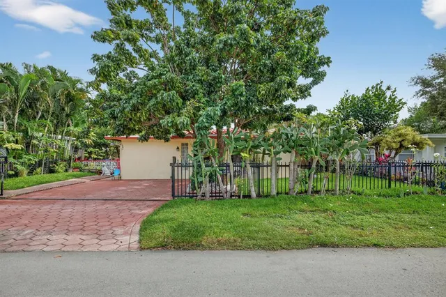a view of a backyard with a small house