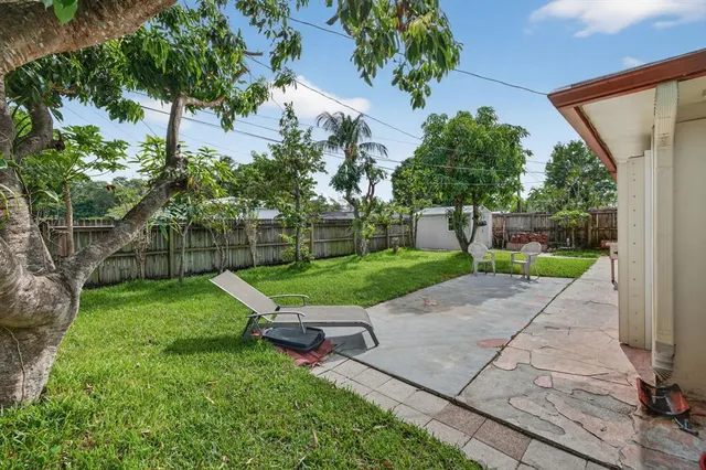 a view of backyard with a garden and entertaining space
