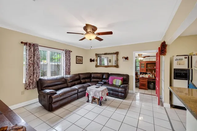 a living room with furniture and a window