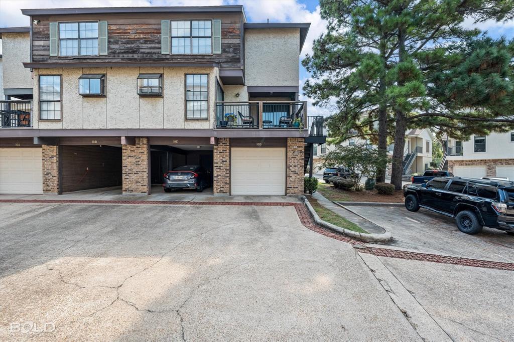 3100 Fairfield Avenue, Unit 10D Shreveport, LA 71104 - Photo 1 of 28 a view of a car park in front of house