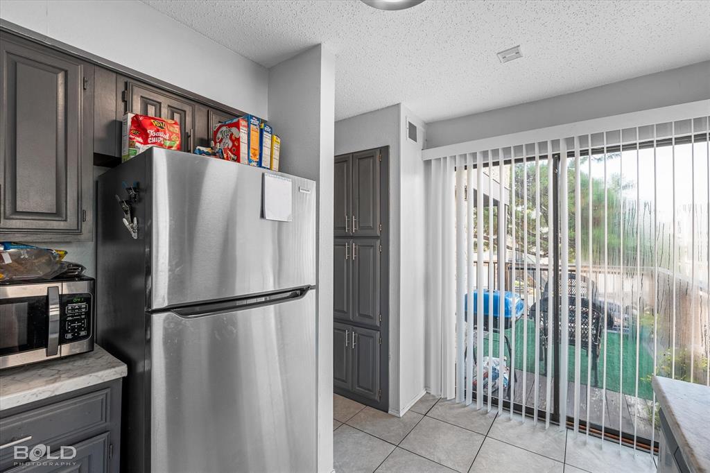 3100 Fairfield Avenue, Unit 10D Shreveport, LA 71104 - Photo 15 of 28 a refrigerator freezer sitting inside of a kitchen
