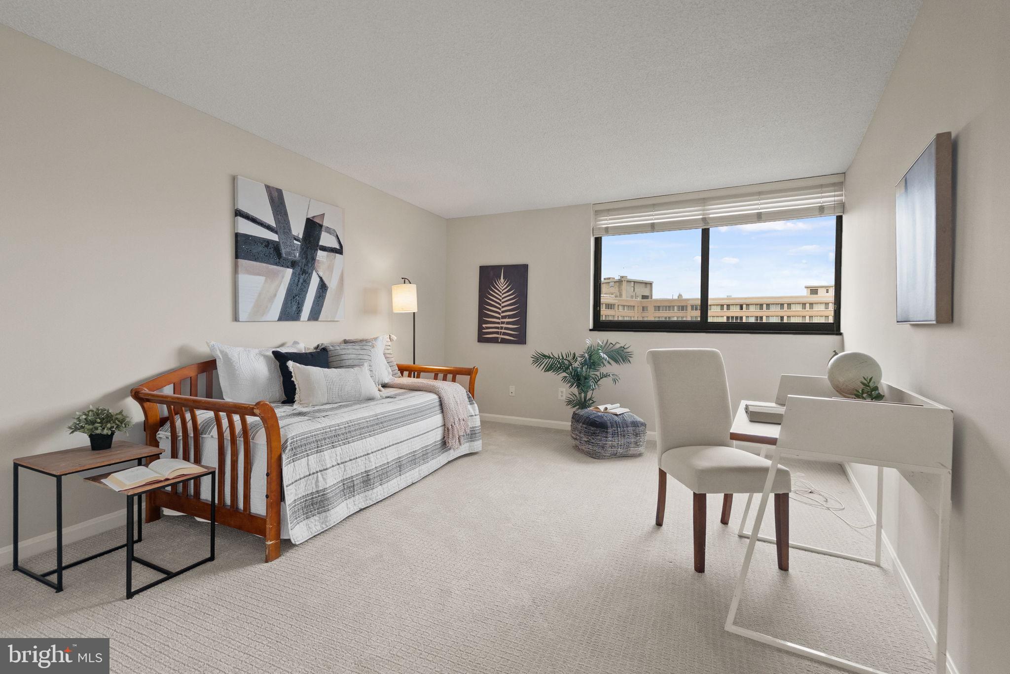 1101 South Arlington Ridge Road, Unit 313 Arlington, VA 22202 - Photo 23 of 59 a living room with furniture and a painting on the wall