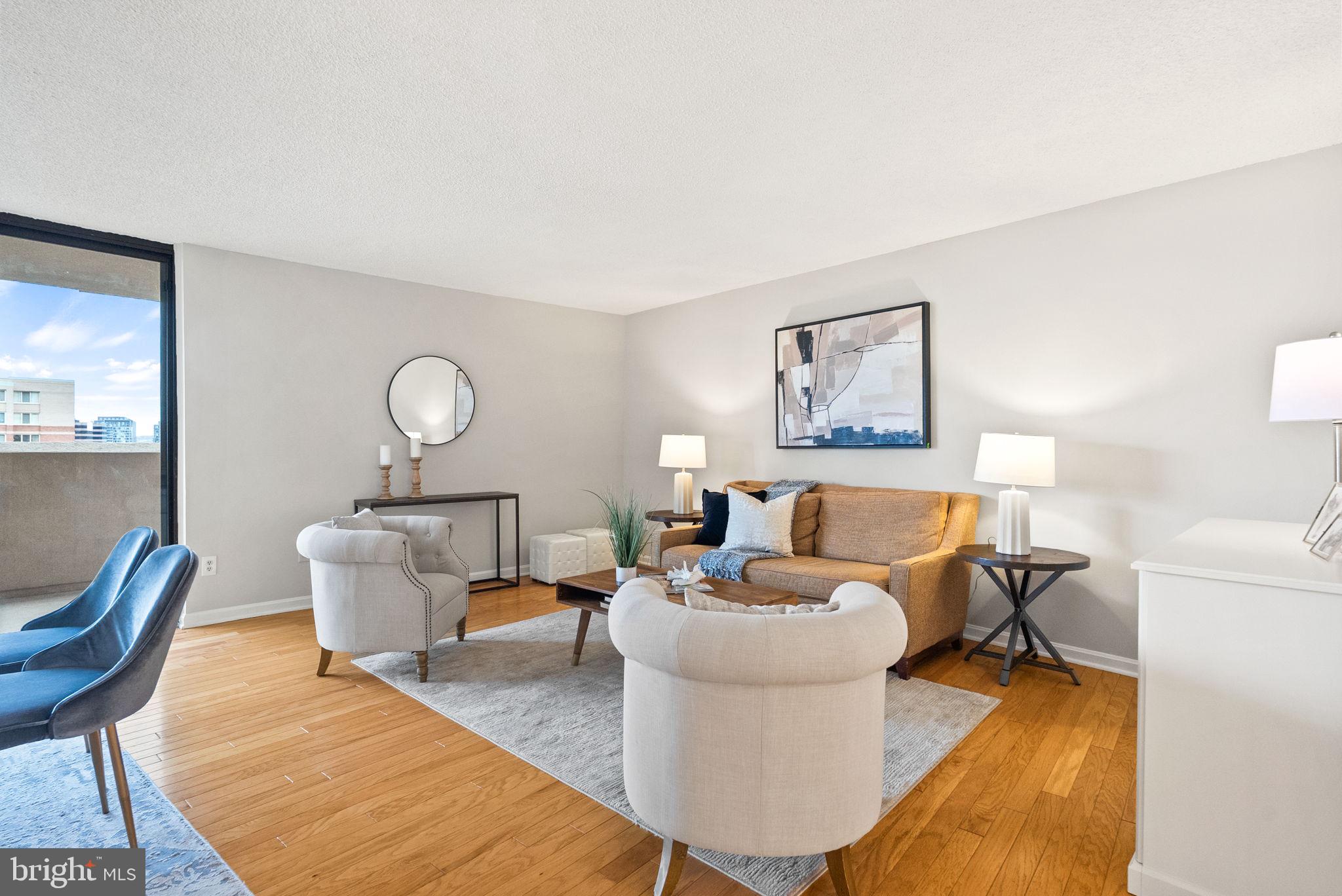 1101 South Arlington Ridge Road, Unit 313 Arlington, VA 22202 - Photo 6 of 59 a living room with furniture and a painting
