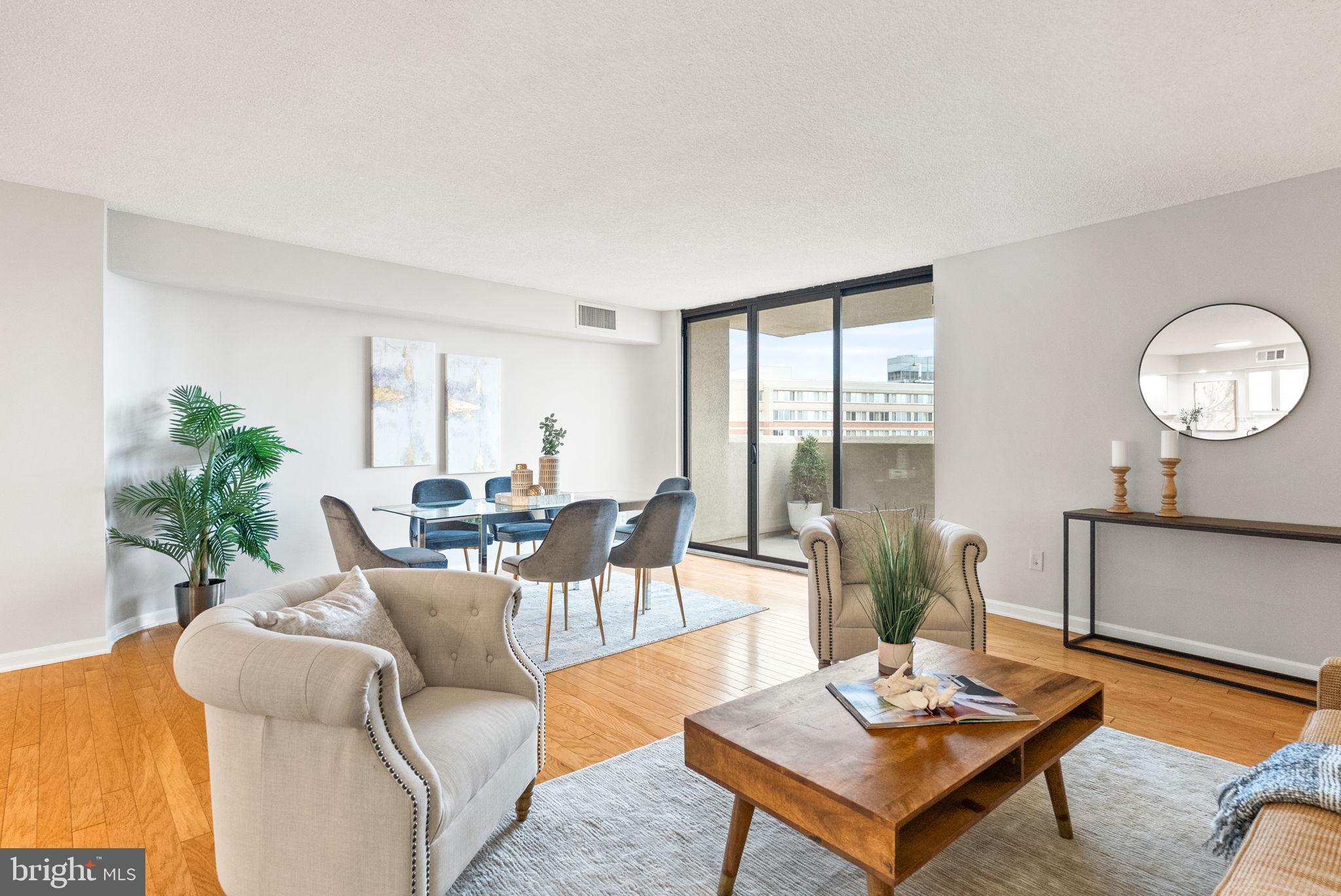 1101 South Arlington Ridge Road, Unit 313 Arlington, VA 22202 - Photo 7 of 59 a living room with furniture and a large window