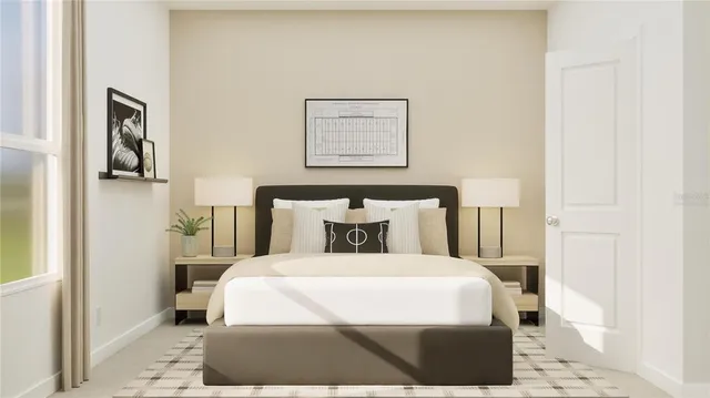 a bedroom with a bed and painting on the wall