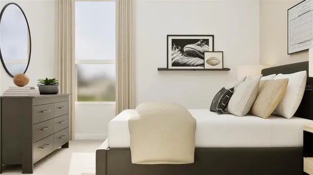 a bedroom with a bed and a dresser