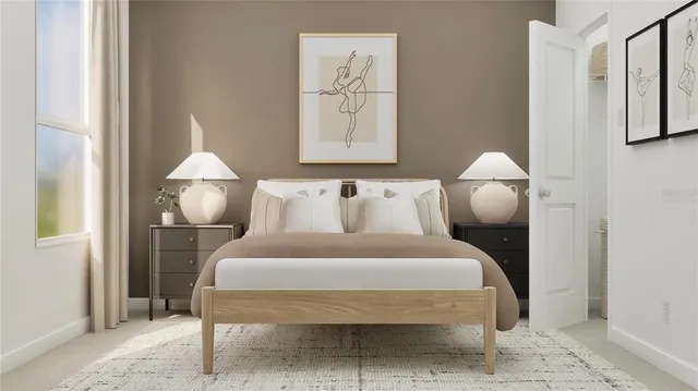 a large white bed in a white room