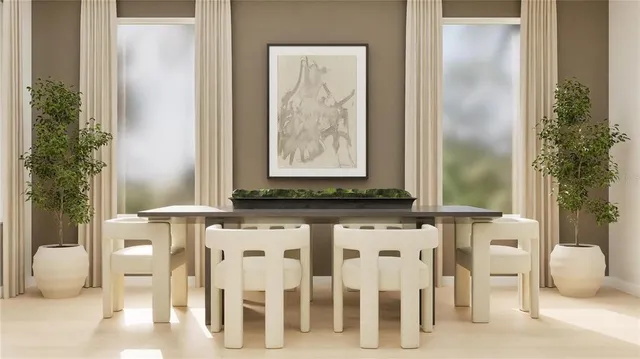 a view of a dining table chair and potted plant