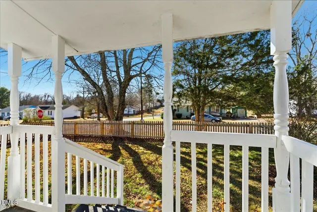a view of a house with a yard covered in snow