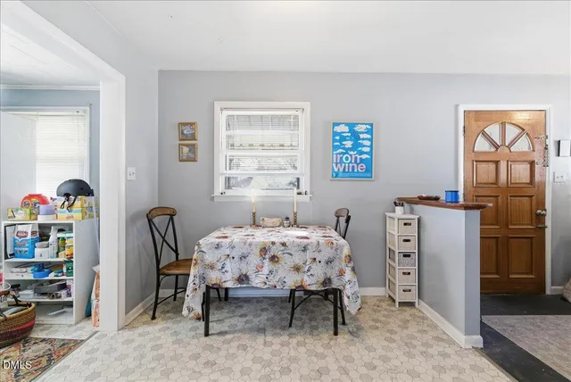 a bedroom with a bed dresser and a window