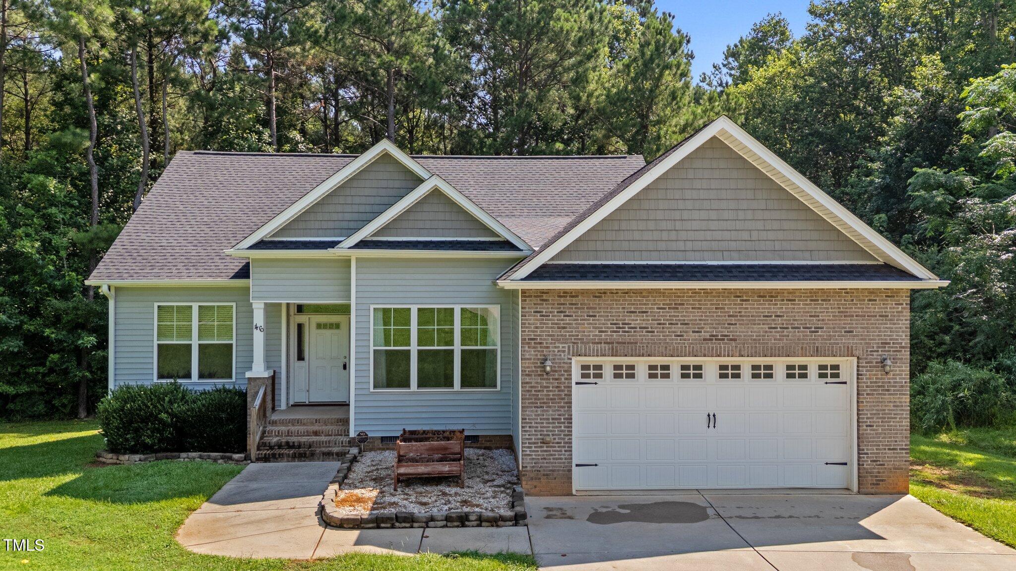 46 Trusting Lane Middlesex, NC 27557 - Photo 1 of 35 a front view of a house with a yard