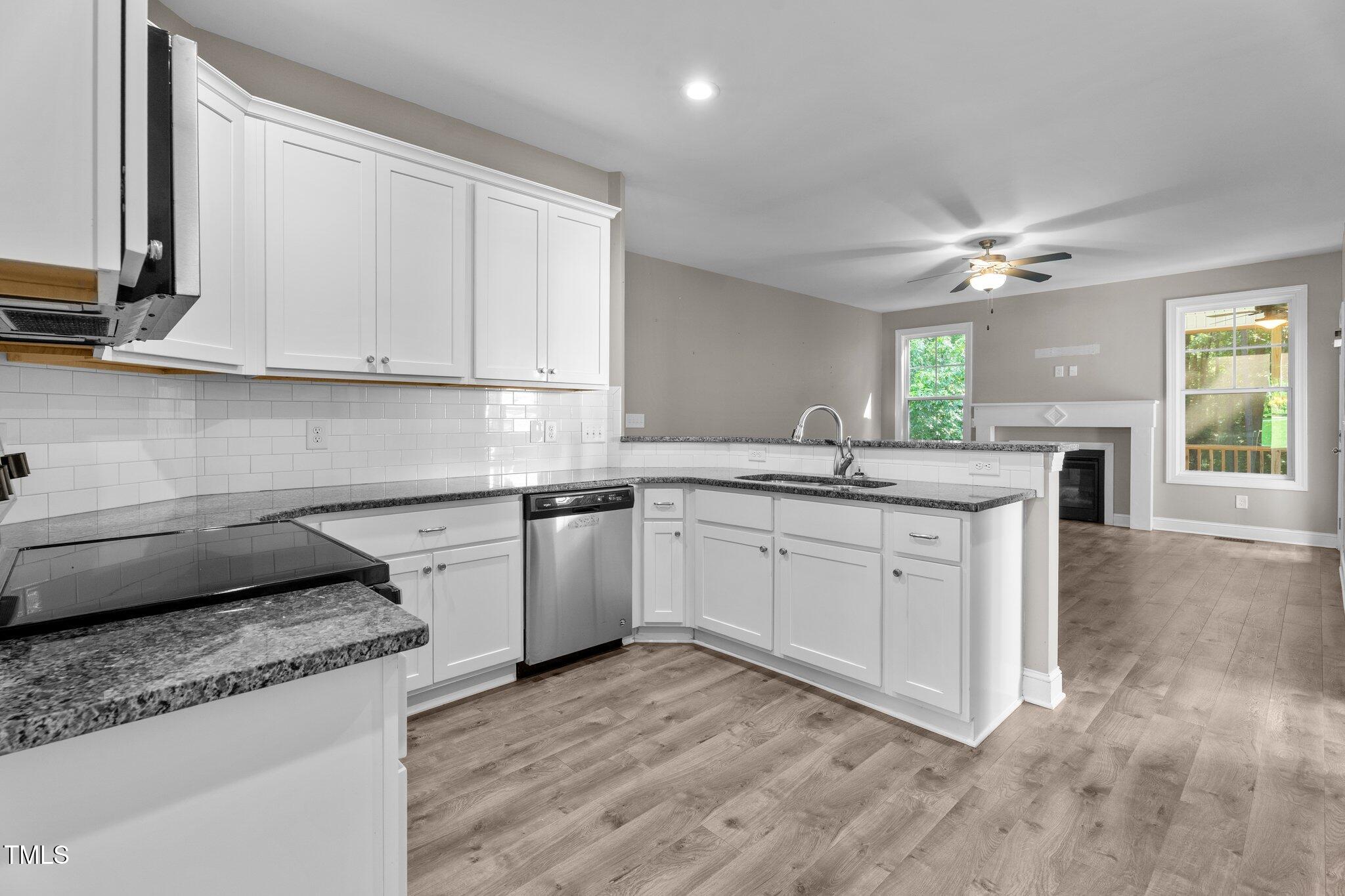 46 Trusting Lane Middlesex, NC 27557 - Photo 19 of 35 a kitchen with granite countertop cabinets stainless steel appliances a sink and a window