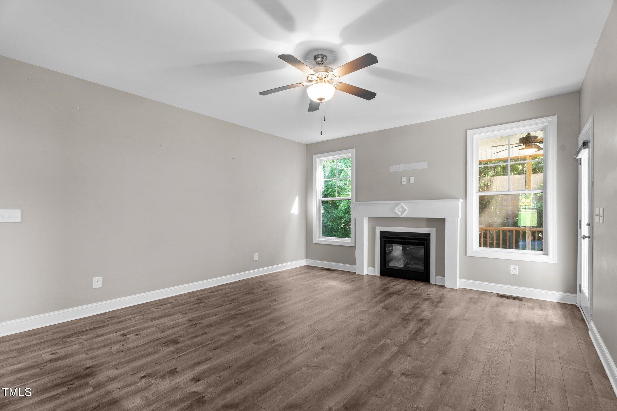 46 Trusting Lane Middlesex, NC 27557 - Photo 22 of 35 a view of an empty room with a fireplace and a window