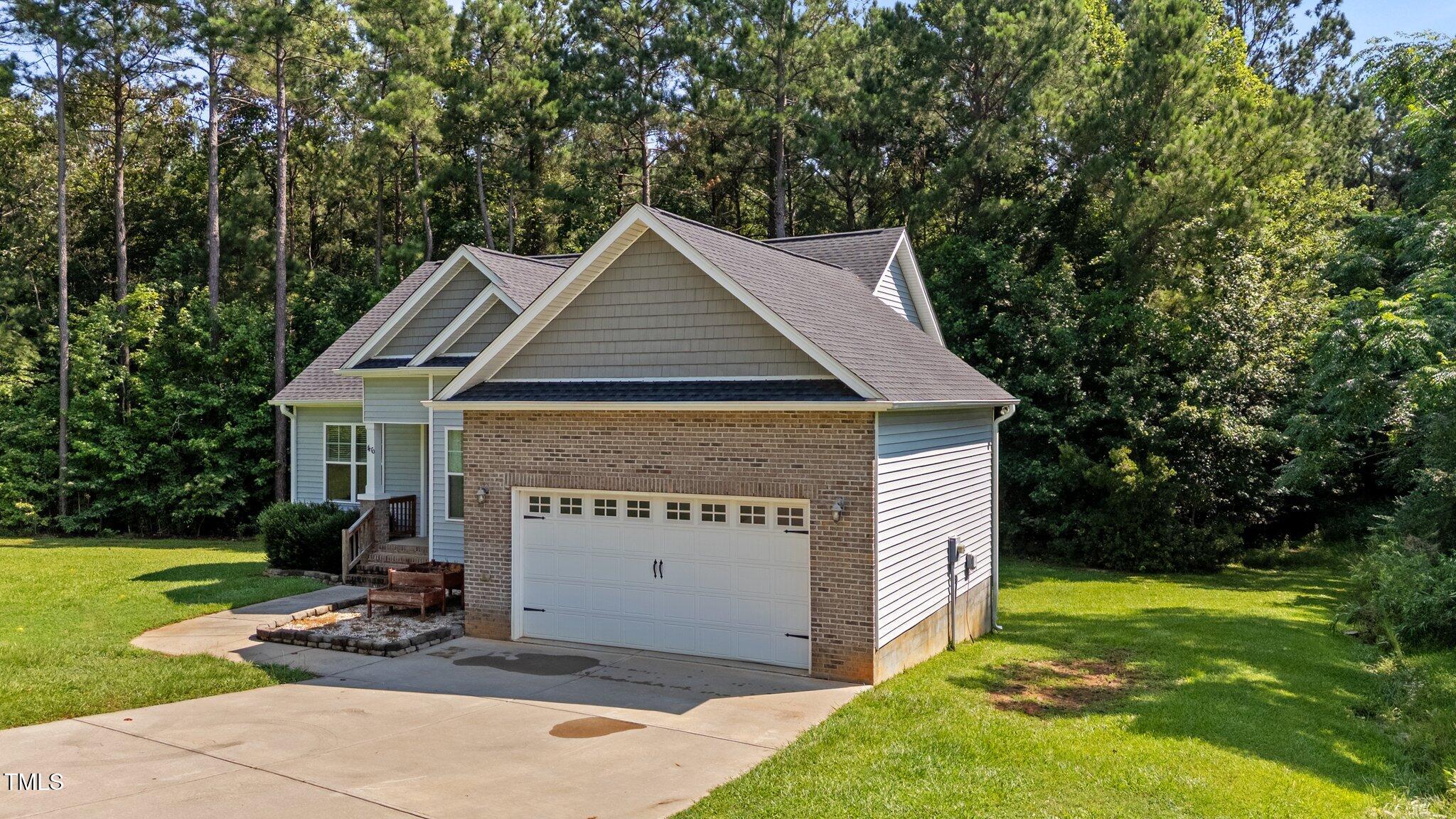 46 Trusting Lane Middlesex, NC 27557 - Photo 3 of 35 a view of a house with backyard