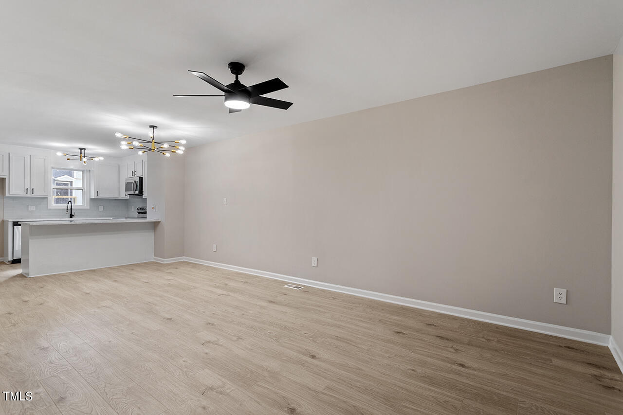 367 East Williams Street Angier, NC 27501 - Photo 15 of 33 a view of a kitchen with marble kitchen and kitchen counter top