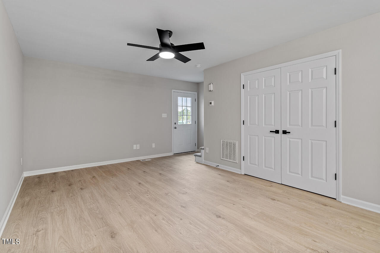 367 East Williams Street Angier, NC 27501 - Photo 18 of 33 wooden floor in an empty room