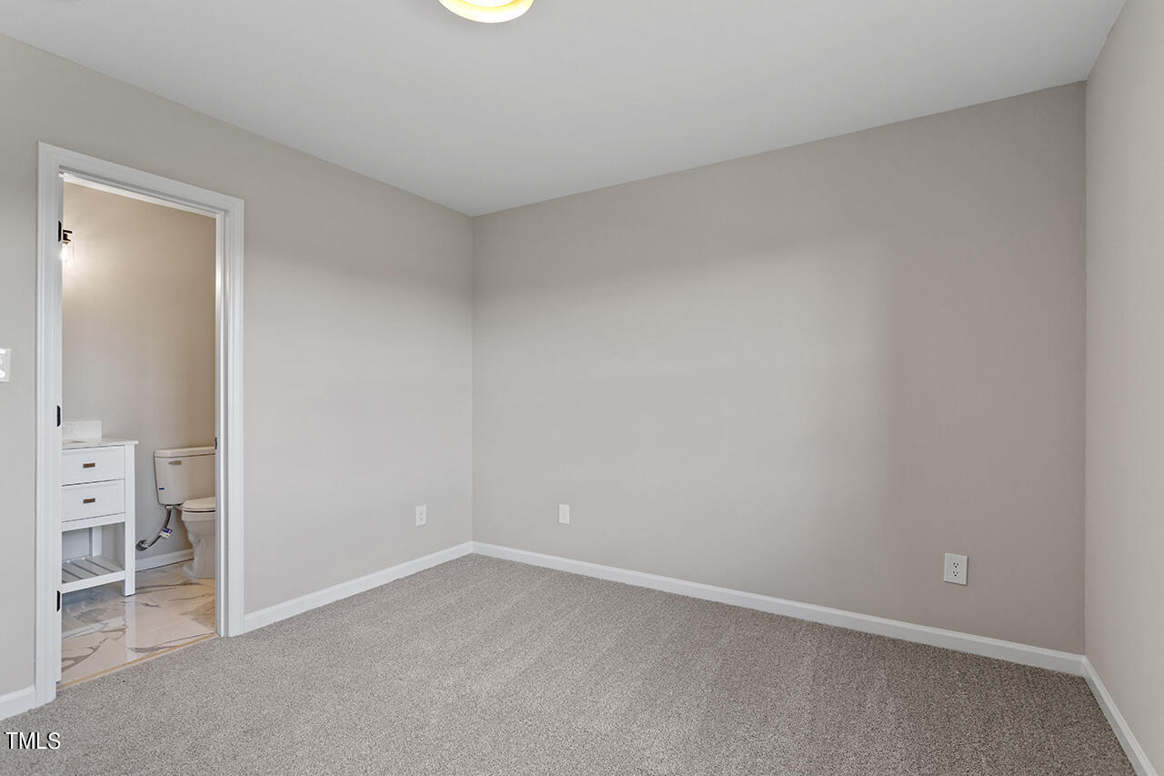 367 East Williams Street Angier, NC 27501 - Photo 25 of 33 an empty room and a bathroom