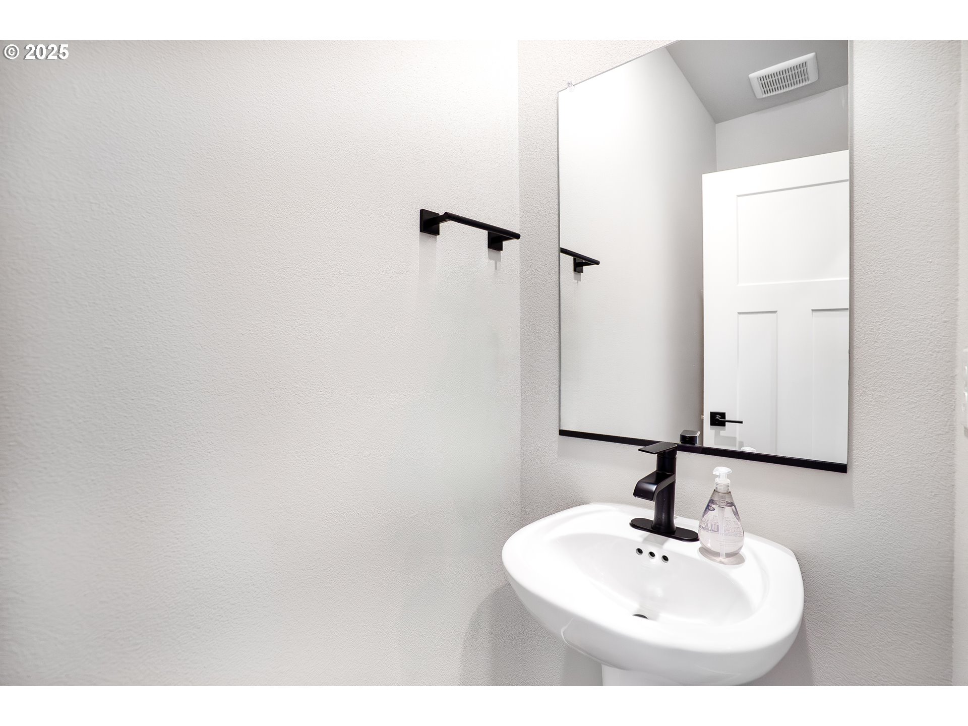 5269 North 87th Avenue Camas, WA 98607 - Photo 14 of 48 a bathroom with a sink and a mirror