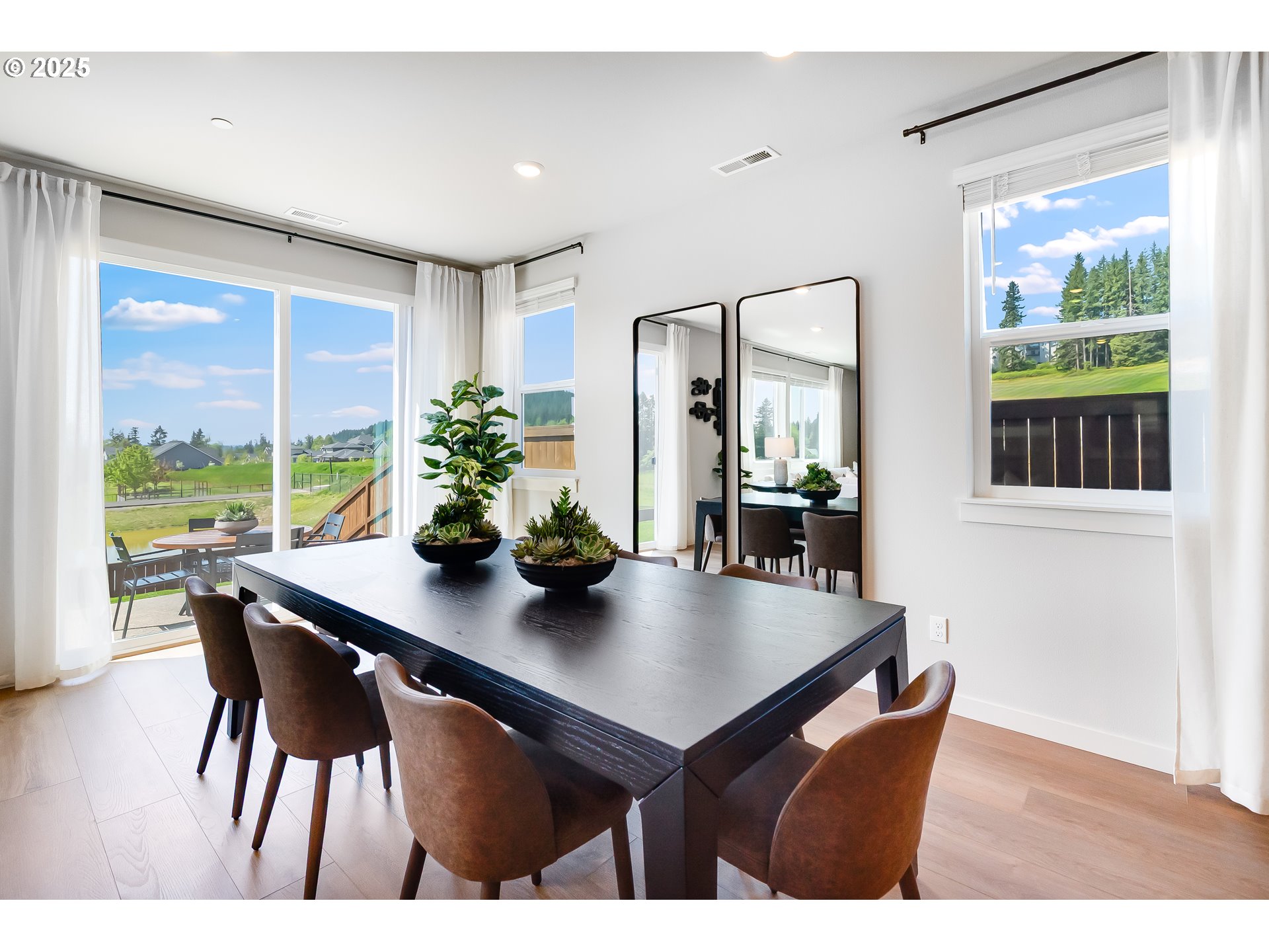 5269 North 87th Avenue Camas, WA 98607 - Photo 18 of 48 a view of a dining room with furniture window and wooden floor