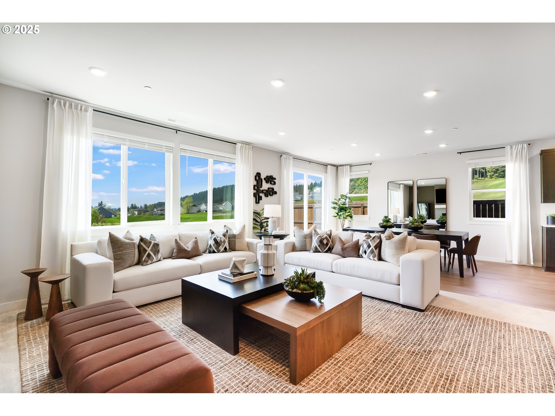 5269 North 87th Avenue Camas, WA 98607 - Photo 19 of 48 a living room with furniture large windows and wooden floor