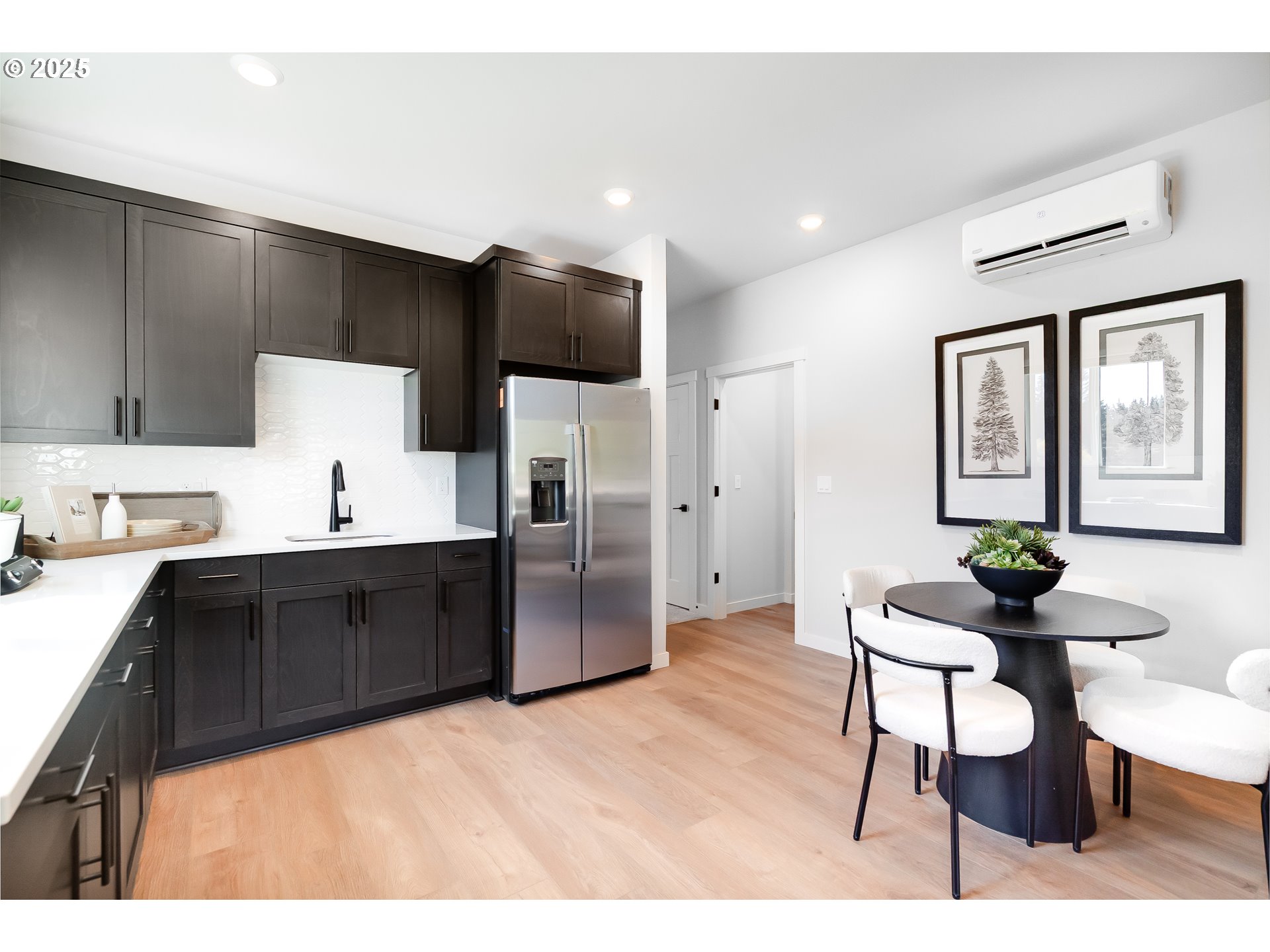 5269 North 87th Avenue Camas, WA 98607 - Photo 24 of 48 a kitchen with a sink cabinets and wooden floor