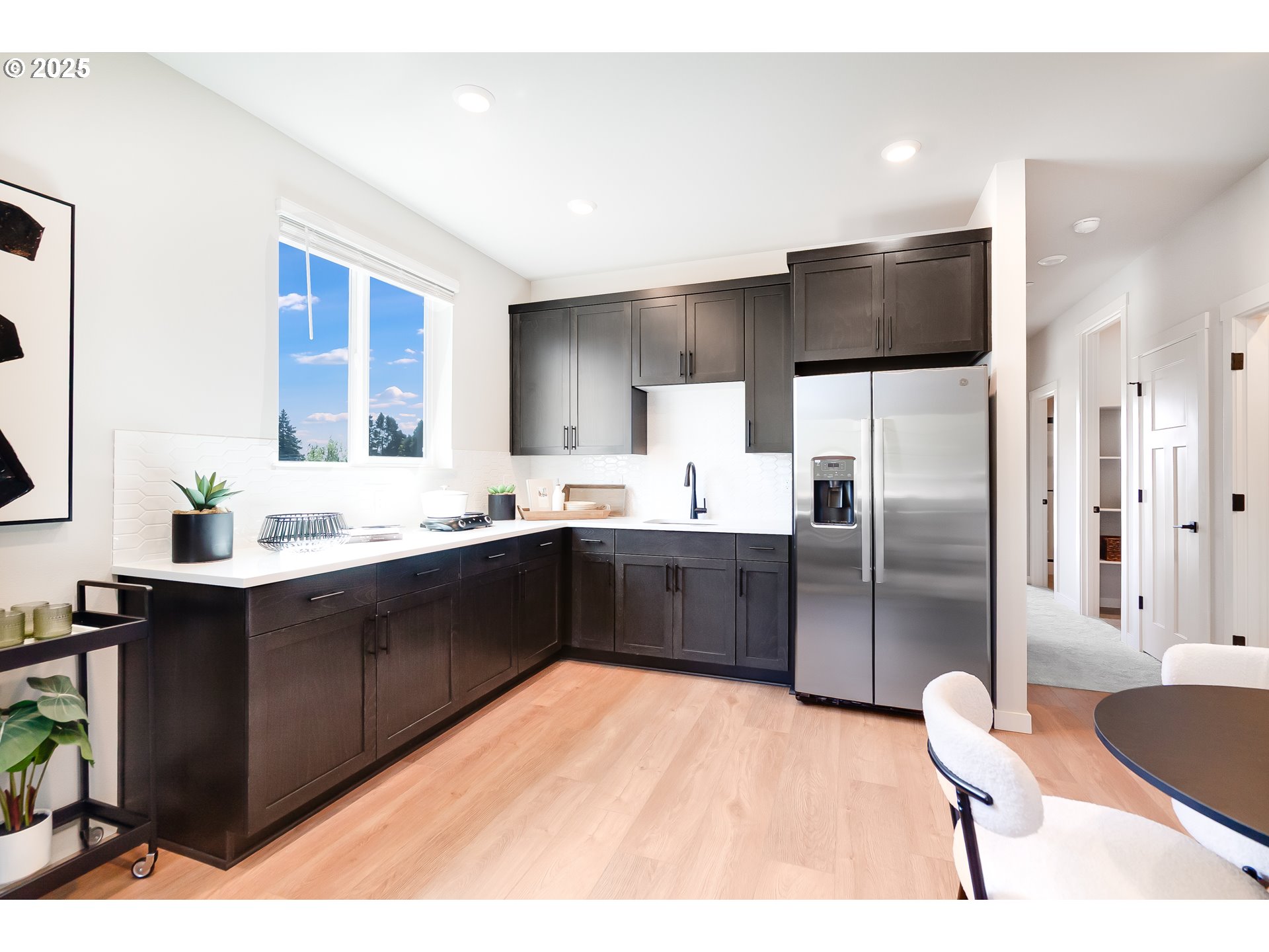 5269 North 87th Avenue Camas, WA 98607 - Photo 25 of 48 a kitchen with a sink refrigerator and cabinets