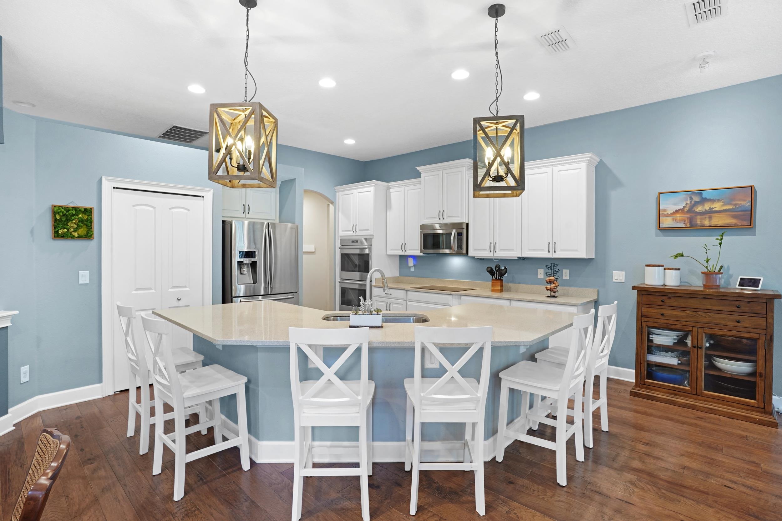 1308 Acorn Ridge Court St. Augustine, FL 32092 - Photo 8 of 47 a view of a dining room and kitchen with a table chairs