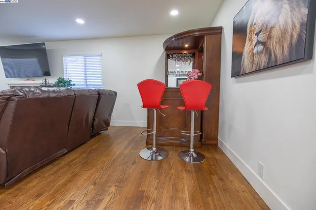 a view of a dining room with furniture and chandelier