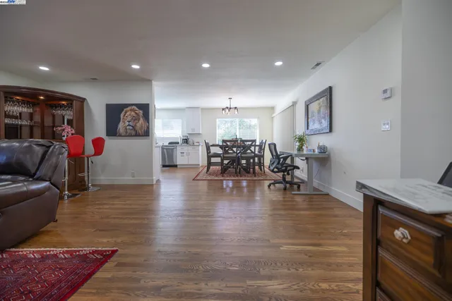 a view of a dining room with furniture and wooden floor
