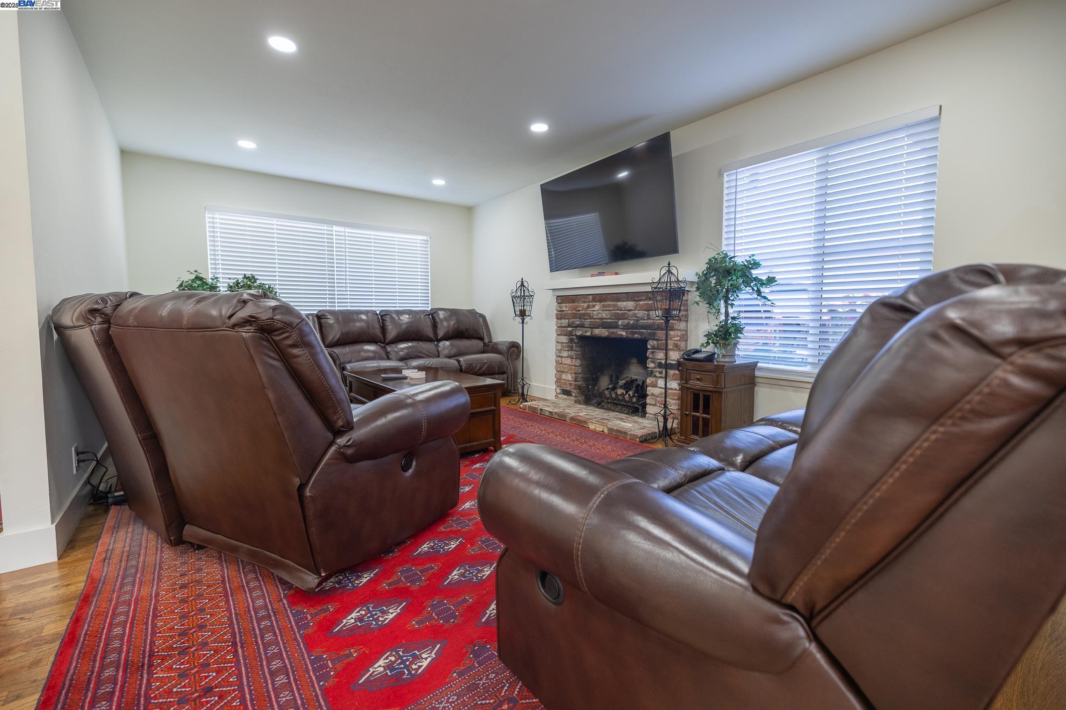 767 Lemos Avenue Salinas, CA 93901 - Photo 16 of 60 a living room with furniture fireplace and flat screen tv