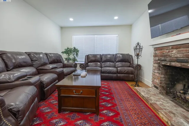 a room with a bed and wooden floor