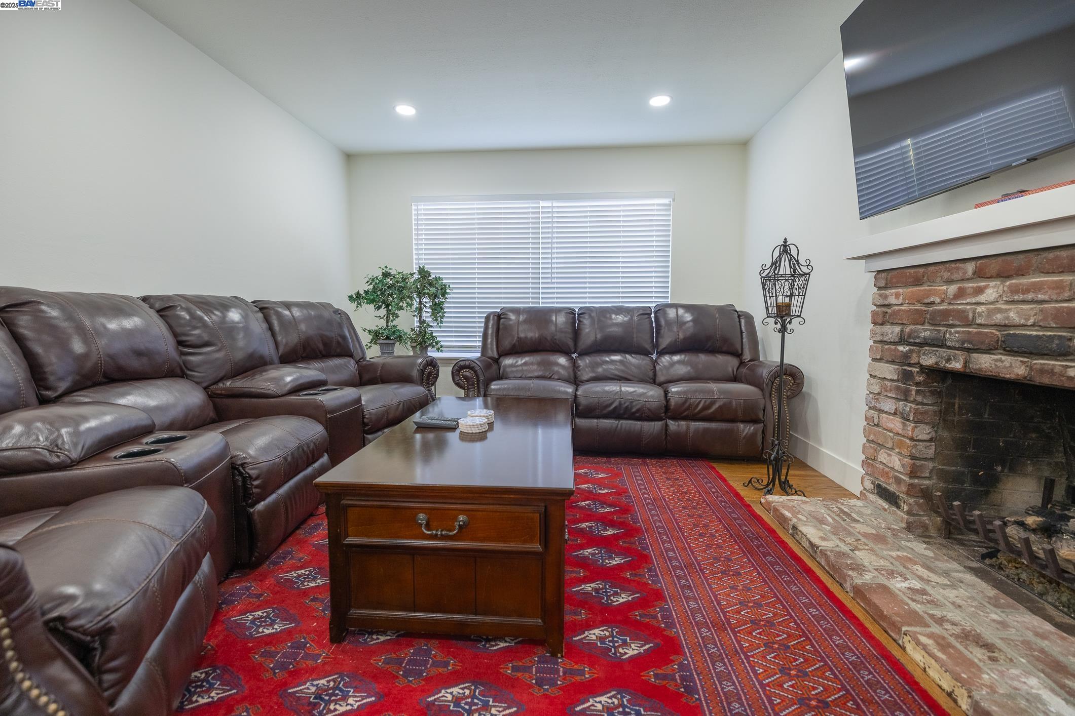767 Lemos Avenue Salinas, CA 93901 - Photo 19 of 60 a living room with furniture a couch and a fireplace