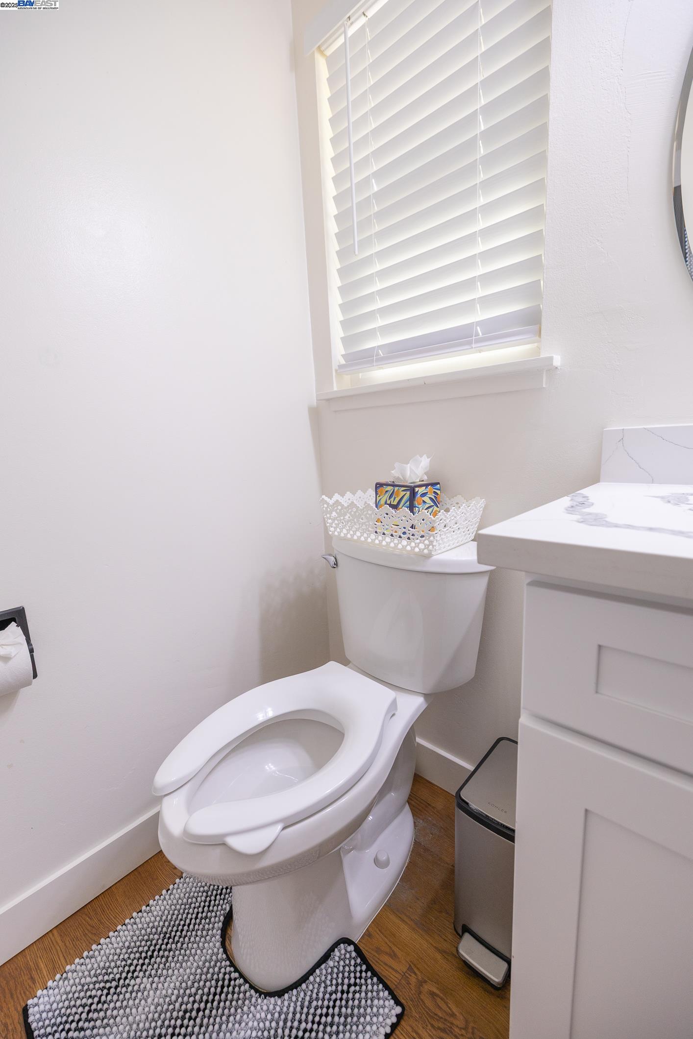 767 Lemos Avenue Salinas, CA 93901 - Photo 27 of 60 Elegant master suite featuring rich hardwood floors, a modern bedroom set, mirrored wardrobe, and a serene layout. The attached spa-inspired bath offers a quartz vanity, matte-black fixtures, and a beautifully tiled glass shower. Furniture Included.