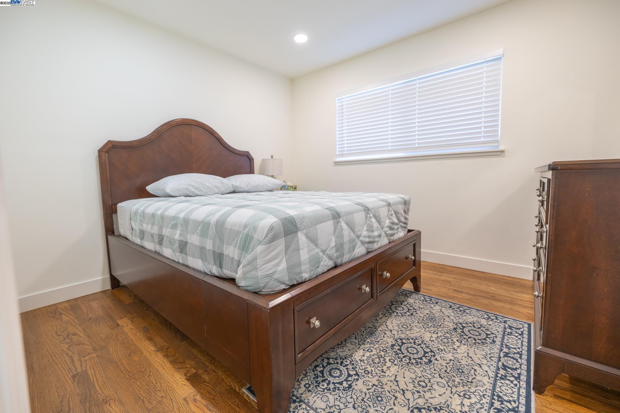 767 Lemos Avenue Salinas, CA 93901 - Photo 29 of 60 a room with a bed and wooden floor
