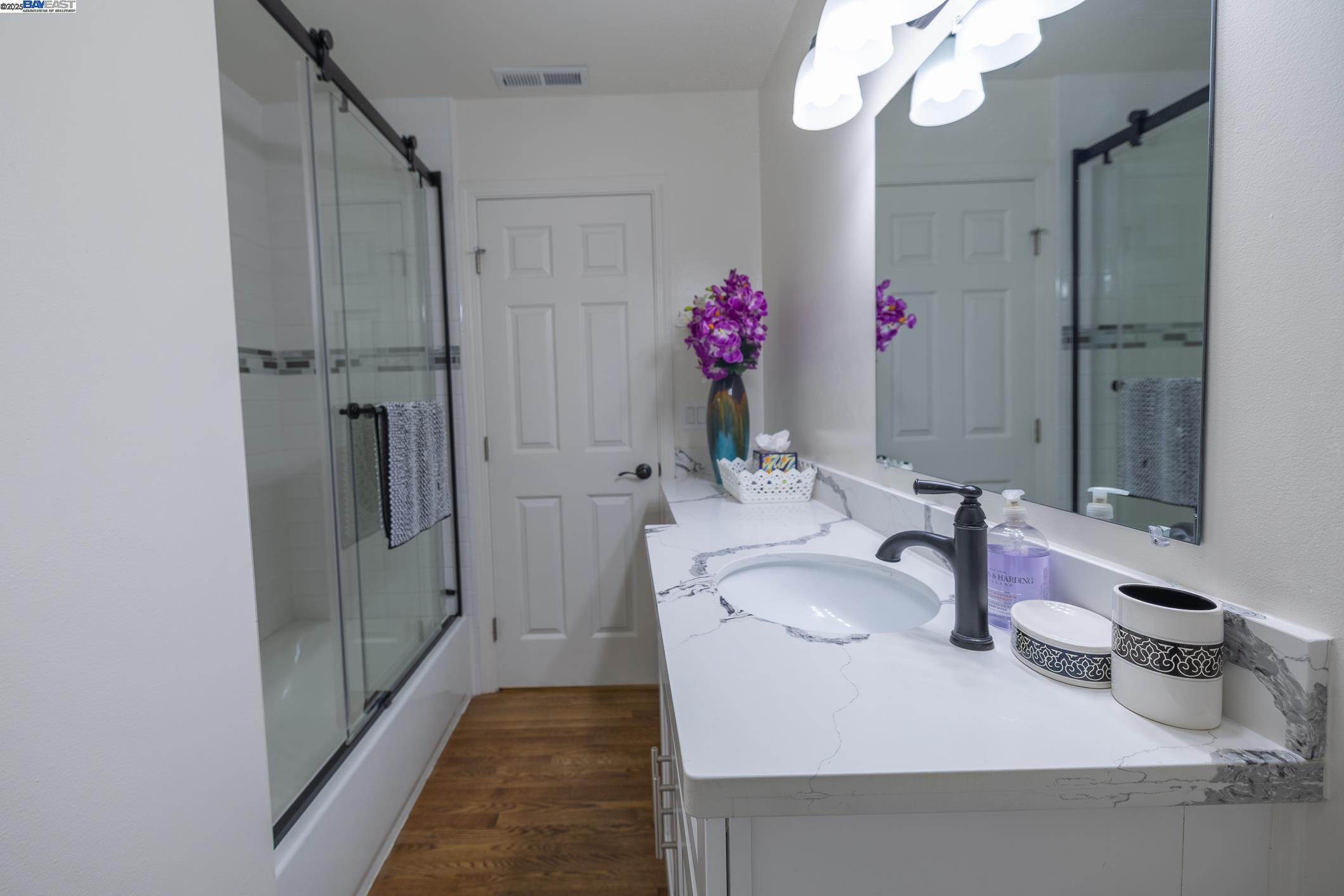 767 Lemos Avenue Salinas, CA 93901 - Photo 33 of 60 a bathroom with a granite countertop sink a large mirror and shower