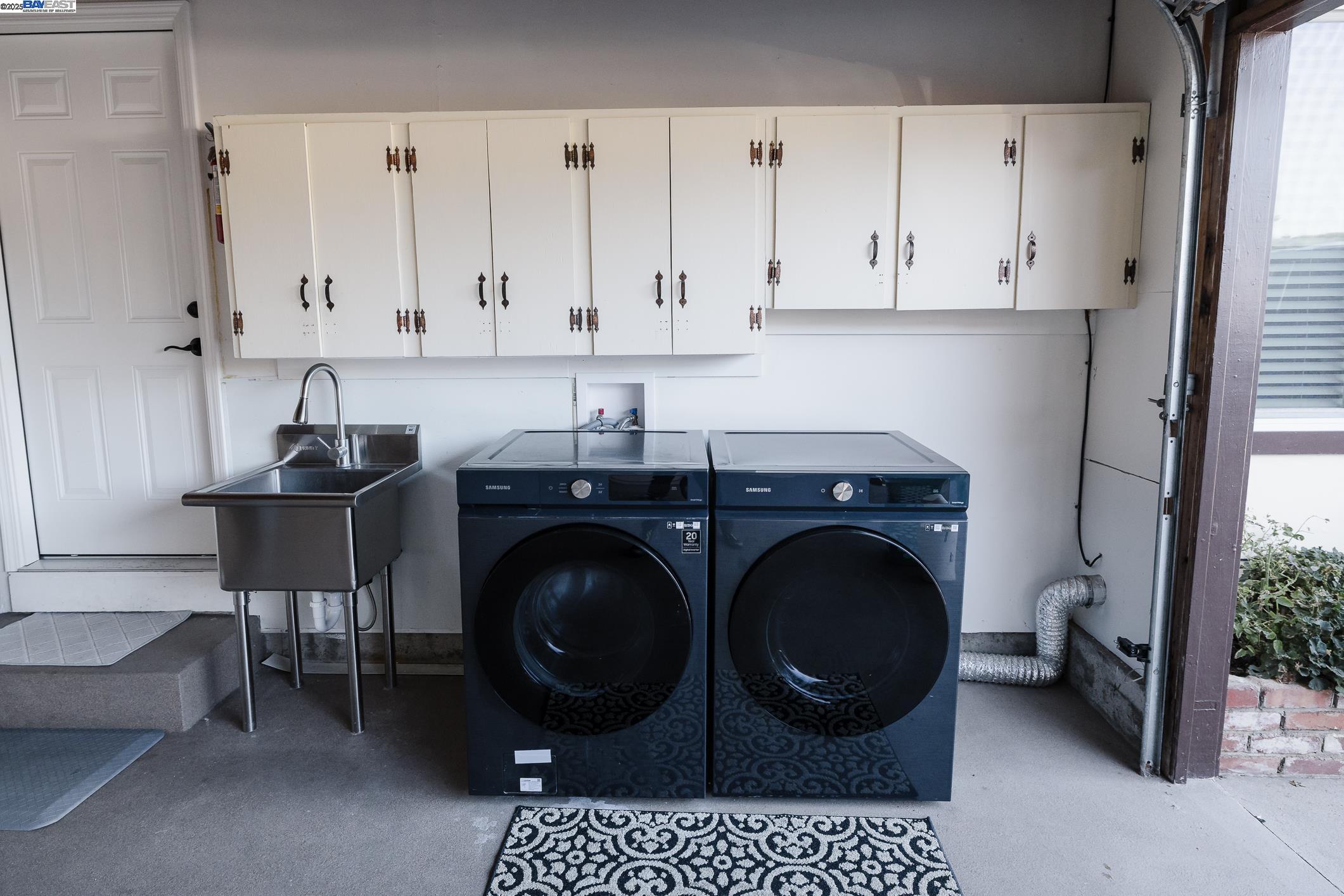 767 Lemos Avenue Salinas, CA 93901 - Photo 35 of 60 Spacious 2-car garage with overhead cabinetry, stainless utility sink, and premium Samsung washer/dryer. Additional 2-car carport parking in front adds convenience and flexibility. Clean, organized, and functional. Appliances Included.