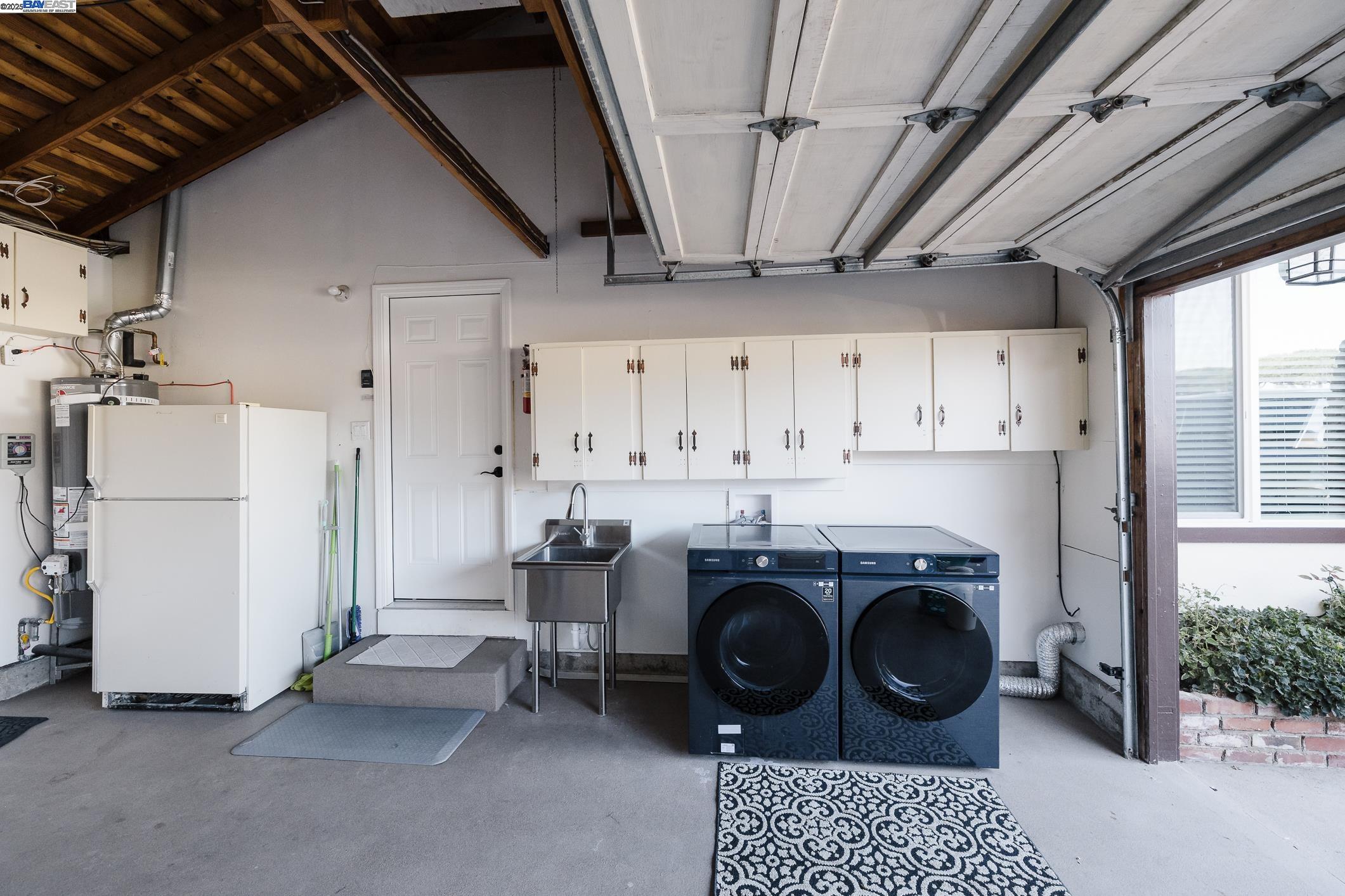 767 Lemos Avenue Salinas, CA 93901 - Photo 36 of 60 a kitchen with a stove a refrigerator and cabinets