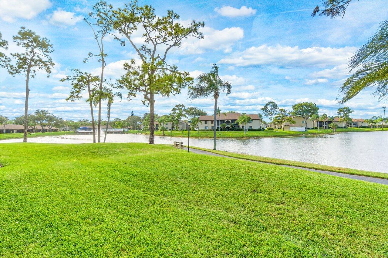 603 Sea Pine Way, Unit E3 Greenacres, FL 33415 - Photo 17 of 22 a view of a park with large trees